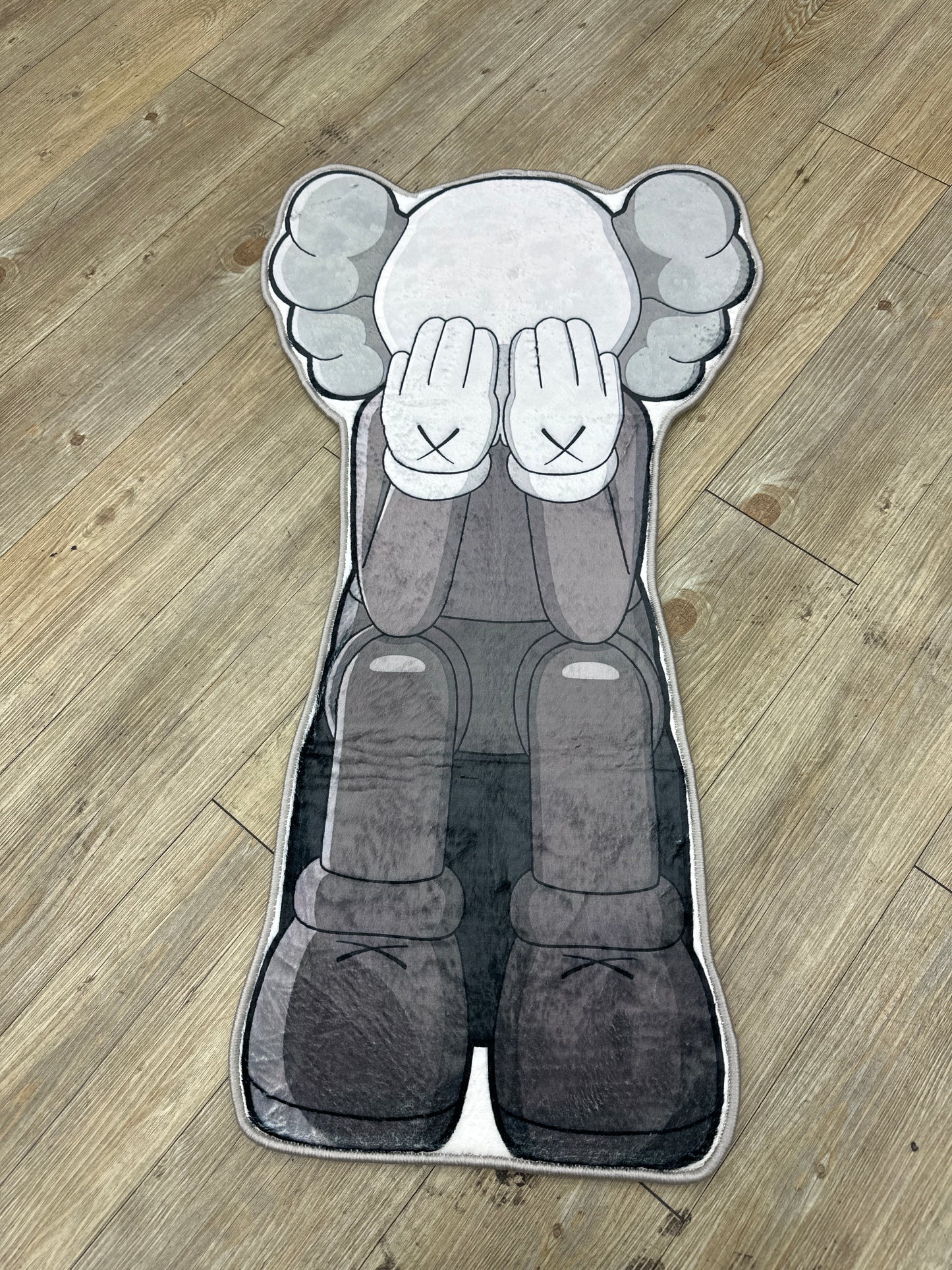 Kaws statue rug