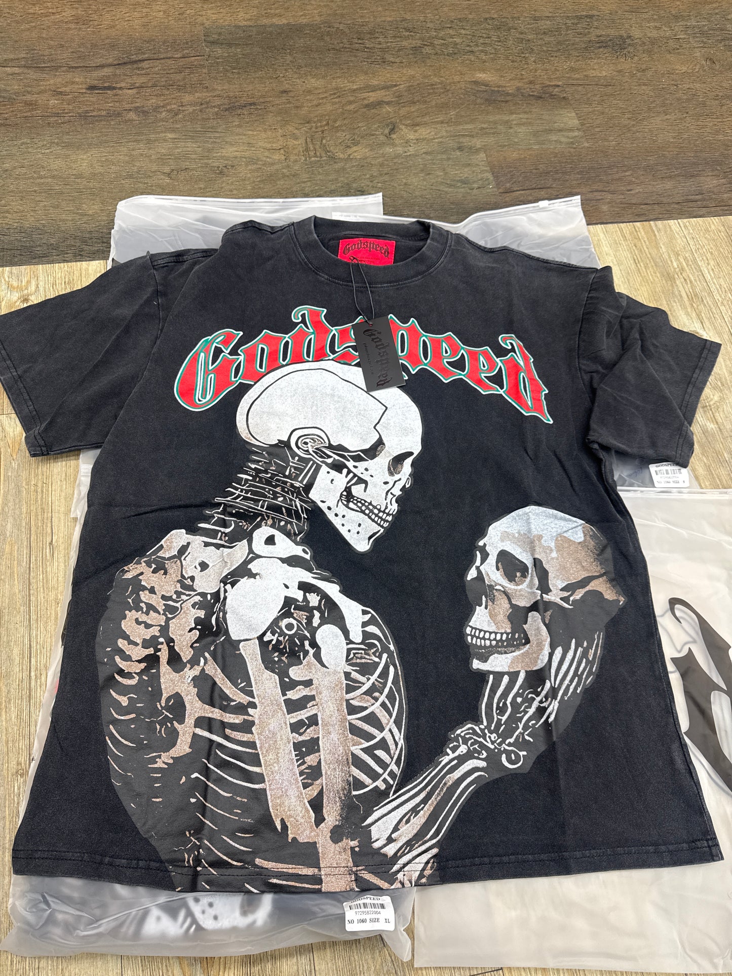 God speed black skeleton looking at skull tee